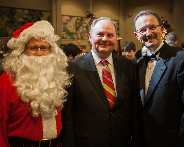 Musicians and Santa Claus at a holiday concert